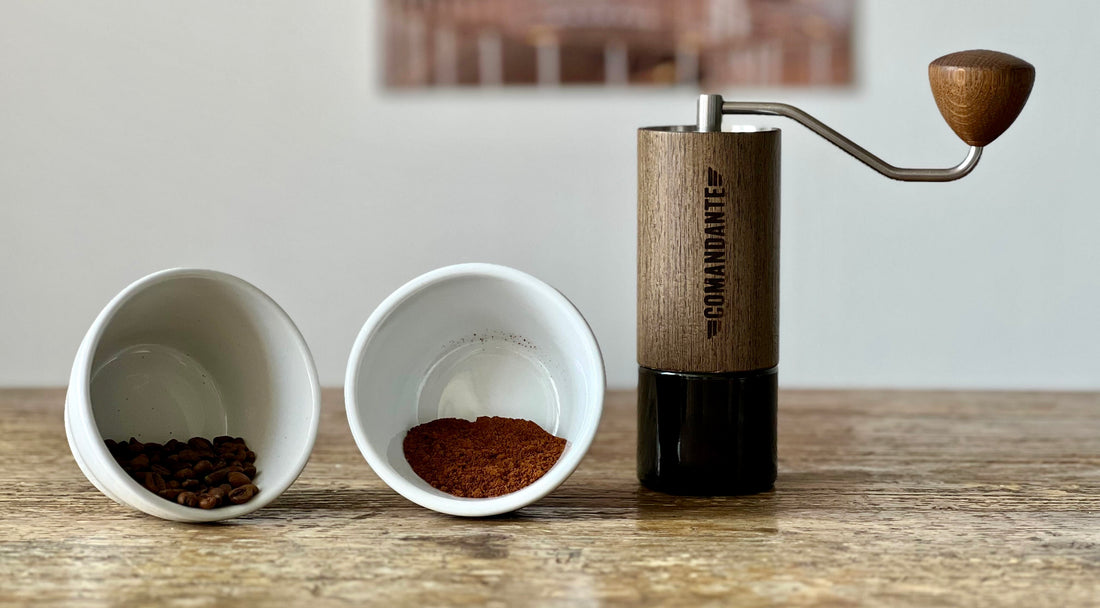The Comandante hand grinder with ground coffee