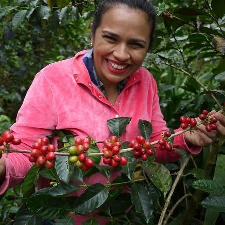 Marysabel Caballero with coffee plants in Honduras