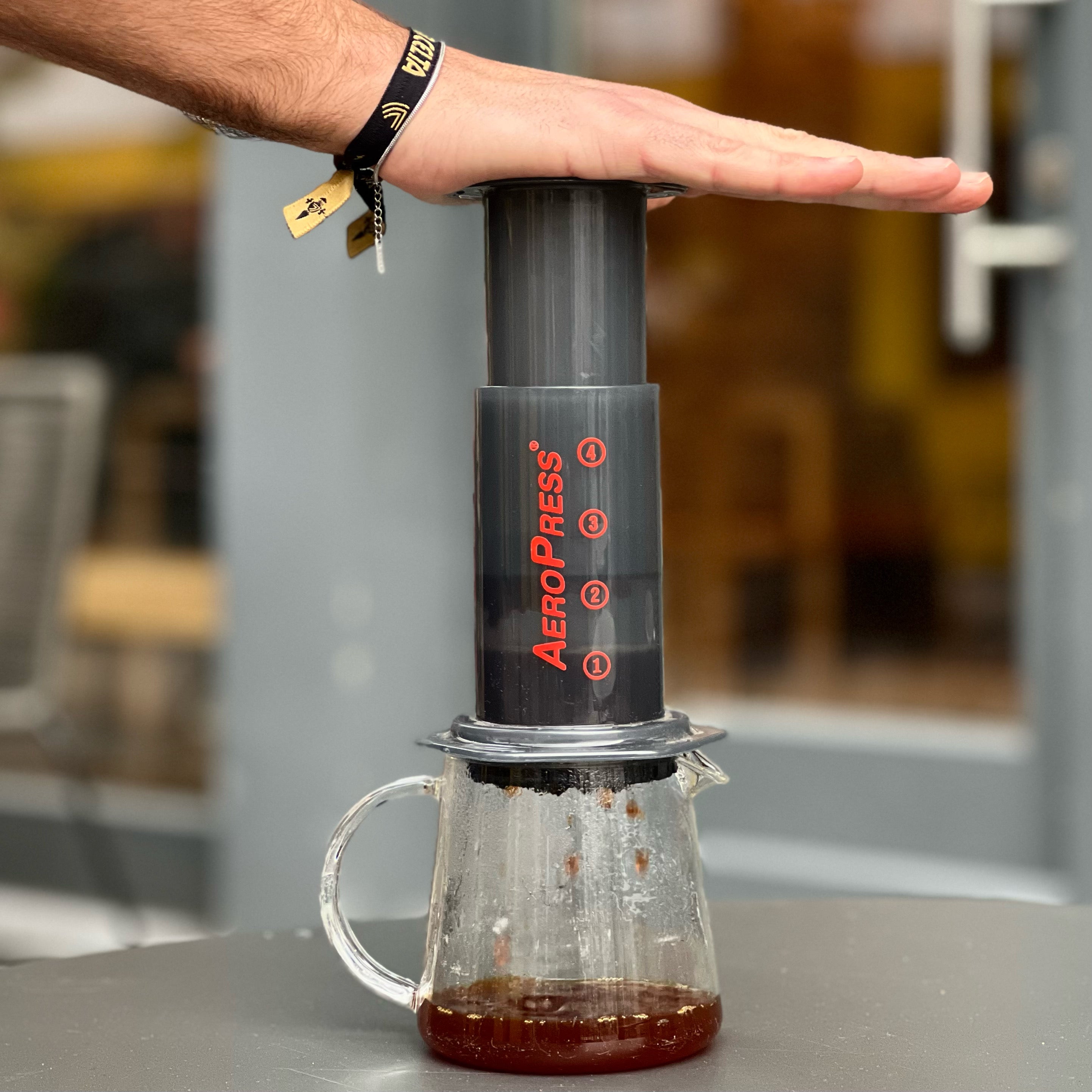 Person using an Aeropress 