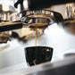 Espresso dripping out from La Marzocco into a cup